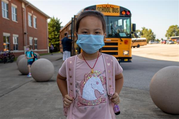student smiles on first day of school